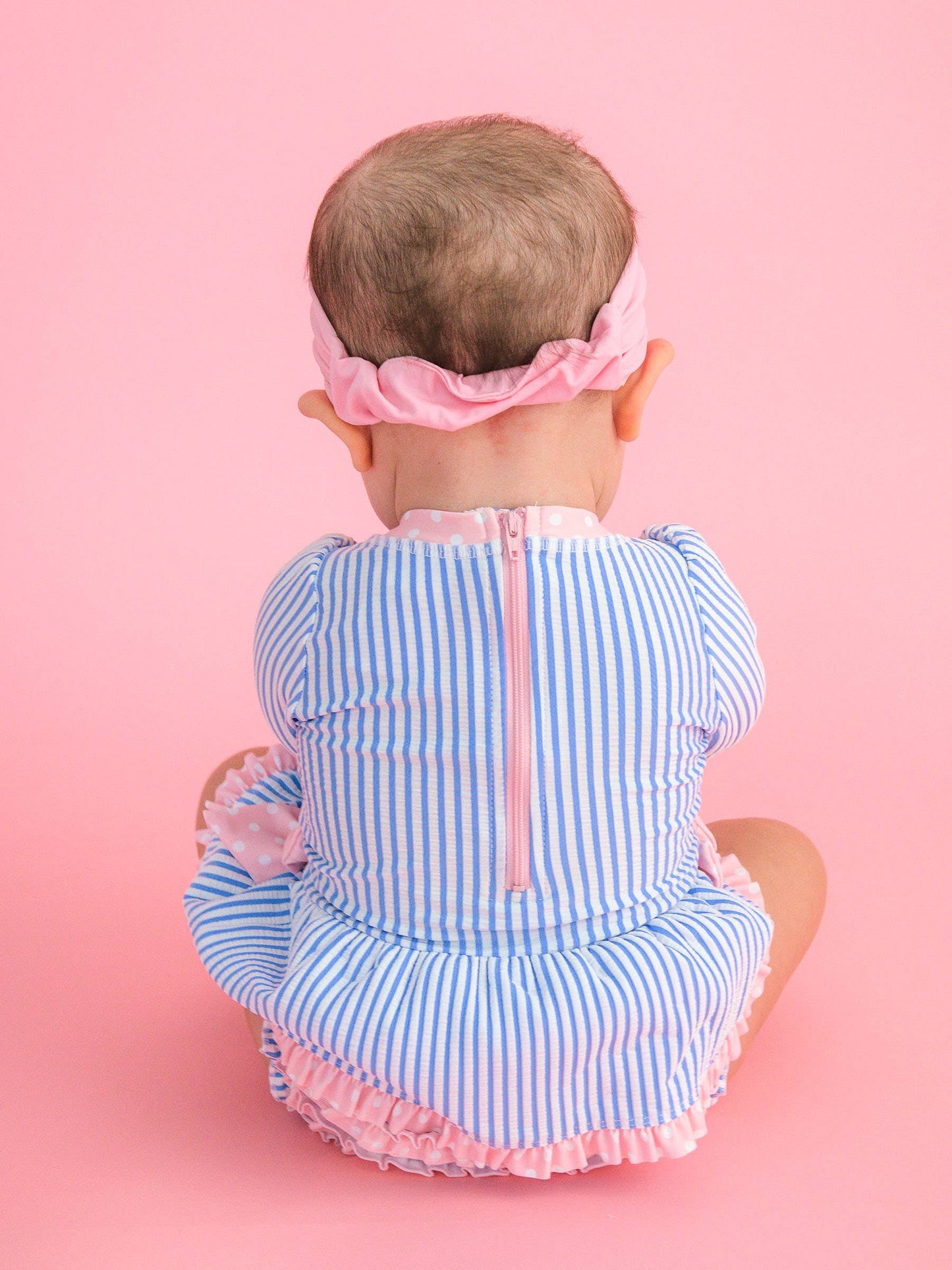 Rufflebutts Baby Girls Periwinkle Blue Seersucker Long Sleeve One Piece Bow Peplum Rash Guard Swimsuit with Signature Rear Ruffles
