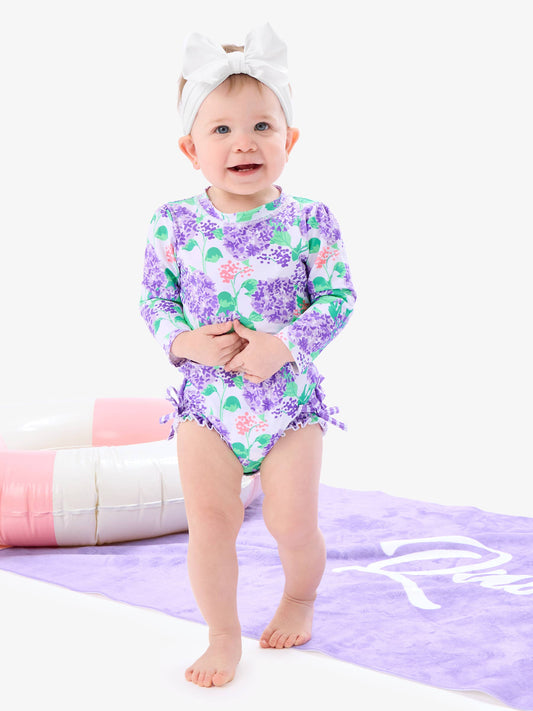 Rufflebutts Baby Girls Purple Hydrangea Garden Long Sleeve One Piece Rash Guard Swimsuit with Signature Rear Ruffles